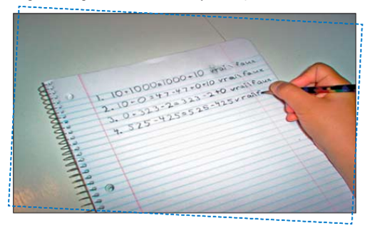 A student is writing mathematical equations in a notebook.