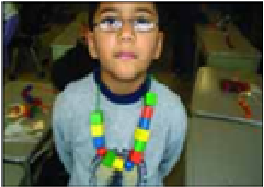 An example of a sequence of a student wearing beaded necklace, with repeated patterns.