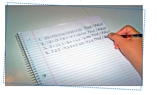 A student is writing mathematical equations in a notebook.