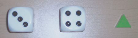 Two dice with faces 3, and 4, and a green triangle.