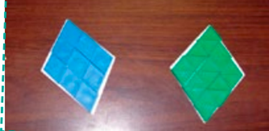 Deux losanges, l’un est constitué de 9 petits losanges bleus. L’autre est constitué de 9 petits losanges verts.