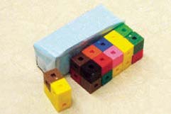A paper prism is compared with a prism made of interlocking cubes.